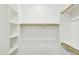 Large walk-in closet featuring built in shelves and clothes rods at 5100 E Rancho Paloma Dr # 2061, Cave Creek, AZ 85331