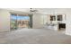 Spacious living area with views to the outside, kitchen bar, and a ceiling fan for added comfort at 5100 E Rancho Paloma Dr # 2061, Cave Creek, AZ 85331
