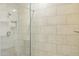 Tiled shower showcasing neutral tile, a shower niche, and glass door at 5100 E Rancho Paloma Dr # 2061, Cave Creek, AZ 85331