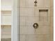 Shower featuring neutral tile, a shower niche, and view to closet at 5100 E Rancho Paloma Dr # 2061, Cave Creek, AZ 85331