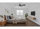 Staged bedroom with ceiling fan, mounted tv and floating shelves at 7109 E Gamebird Way, San Tan Valley, AZ 85143