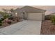 Charming single-story home with desert landscaping, and a two-car garage at 7109 E Gamebird Way, San Tan Valley, AZ 85143