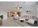 Open-concept living room seamlessly connects to the kitchen with stainless steel appliances at 7109 E Gamebird Way, San Tan Valley, AZ 85143