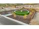 Aerial shot of park featuring a circular green area, landscaping, walking paths, and mountain views at 7417 W Buckhorn Trl, Peoria, AZ 85383