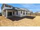 View of the home's backyard, featuring a covered patio, stucco exterior, and ample space for landscaping at 7417 W Buckhorn Trl, Peoria, AZ 85383