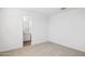 Bright bedroom with neutral carpet and a view of the en-suite bathroom at 7417 W Buckhorn Trl, Peoria, AZ 85383