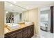 Bright bathroom features double sinks, a large mirror, granite countertops, and a separate tub at 8187 E Del Caverna Dr, Scottsdale, AZ 85258