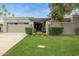 Charming single-story home featuring a well-manicured lawn and a two car garage at 8187 E Del Caverna Dr, Scottsdale, AZ 85258