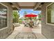 View of the backyard patio with an outdoor dining set and seating area at 8187 E Del Caverna Dr, Scottsdale, AZ 85258