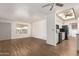 Spacious open-concept living area with vinyl floors connecting the kitchen at 8338 E Milagro Ave, Mesa, AZ 85209