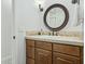 Bathroom with vanity, framed mirror, stylish fixtures, and tile countertop at 902 W Claremont St, Phoenix, AZ 85013