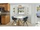 Charming breakfast nook with table, chairs, built in bench and bright windows at 902 W Claremont St, Phoenix, AZ 85013