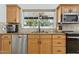 Well-lit kitchen features stainless steel appliances, cabinets, and granite countertops at 902 W Claremont St, Phoenix, AZ 85013