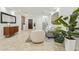 Bright, open living room with tile flooring, neutral decor, and a view of the staircase at 902 W Claremont St, Phoenix, AZ 85013