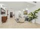 Bright, open living room with tile flooring, neutral decor, and a view of the staircase at 902 W Claremont St, Phoenix, AZ 85013