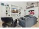 Spacious living room with built-in shelving, comfortable seating, and a view of the upper level at 902 W Claremont St, Phoenix, AZ 85013