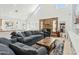 Cozy living room with a high ceiling, brick fireplace, and comfortable seating at 902 W Claremont St, Phoenix, AZ 85013