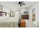 Spacious main bedroom with ensuite bathroom access, balcony access, ceiling fan and neutral decor at 902 W Claremont St, Phoenix, AZ 85013