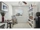 This office features a dedicated work area, ample shelving for storage, and a comfortable chair for focused productivity at 902 W Claremont St, Phoenix, AZ 85013