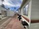Backyard space with brick pavers, a grill, and storage shed for outdoor living at 1147 S Sioux Dr, Apache Junction, AZ 85119