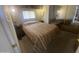 Serene bedroom with a comfortable bed, large mirror, and soft lighting for a relaxing ambiance at 1147 S Sioux Dr, Apache Junction, AZ 85119