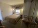Relaxing bedroom showcasing a comfortable bed, ample lighting, and a built-in wardrobe at 1147 S Sioux Dr, Apache Junction, AZ 85119