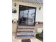 Charming entryway with sliding glass door, brick steps, and decorative outdoor elements at 1147 S Sioux Dr, Apache Junction, AZ 85119