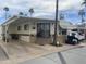 Charming home exterior with a carport, brick accents, and well-maintained landscaping at 1147 S Sioux Dr, Apache Junction, AZ 85119