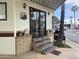 Charming exterior featuring a sliding glass door, brick steps, and carport for parking at 1147 S Sioux Dr, Apache Junction, AZ 85119