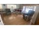 Spacious living room featuring laminate flooring, neutral decor and comfortable furniture at 1147 S Sioux Dr, Apache Junction, AZ 85119