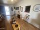 Cozy living room featuring hardwood floors, a decorative fireplace, and bright, neutral walls at 1147 S Sioux Dr, Apache Junction, AZ 85119