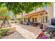 This landscaped backyard has a covered patio and outdoor furniture at 11731 N 91St Pl, Scottsdale, AZ 85260