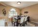 Cozy dining room with an arched window and seating for four people at 11731 N 91St Pl, Scottsdale, AZ 85260