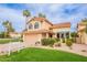 Charming two-story home featuring a well-manicured lawn, desert landscaping, and a two-car garage at 11731 N 91St Pl, Scottsdale, AZ 85260