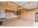 Spacious garage with ample storage cabinets, epoxy floors, and utility sink, offering both functionality and organization at 11731 N 91St Pl, Scottsdale, AZ 85260