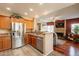 Kitchen with stainless appliances and granite countertops, overlooking living area at 11731 N 91St Pl, Scottsdale, AZ 85260