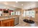 Kitchen with granite counters, stainless appliances and open to the living area at 11731 N 91St Pl, Scottsdale, AZ 85260