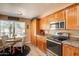 Bright breakfast nook with stainless appliances, cabinetry and granite countertops at 11731 N 91St Pl, Scottsdale, AZ 85260