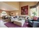 Open concept living room boasts comfortable seating, stylish decor, and an adjacent dining area at 11731 N 91St Pl, Scottsdale, AZ 85260
