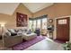 Bright living room features high ceilings, large windows, and stylish decor at 11731 N 91St Pl, Scottsdale, AZ 85260