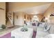 Spacious living room opens to a dining area and features a staircase and stylish decor at 11731 N 91St Pl, Scottsdale, AZ 85260