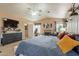Bright bedroom features a large bed, fireplace, a television, and an ensuite bathroom at 11731 N 91St Pl, Scottsdale, AZ 85260