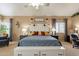 Inviting bedroom featuring a large bed, neutral tones, and bright natural light from the windows at 11731 N 91St Pl, Scottsdale, AZ 85260