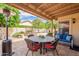 Covered patio area with stylish outdoor furniture perfect for relaxation and entertaining at 11731 N 91St Pl, Scottsdale, AZ 85260