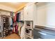 Well-organized walk-in closet with ample storage shelves, rods, and drawers for clothing and accessories at 11731 N 91St Pl, Scottsdale, AZ 85260
