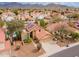 Aerial view of home with solar panels and 2-car garage in a residential area at 13383 N 101St Way, Scottsdale, AZ 85260