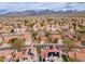 Wide angle aerial of a residential area with terracotta-roofed homes and mountain views in the background at 13383 N 101St Way, Scottsdale, AZ 85260