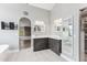 Bright bathroom featuring white countertops, gray cabinets and modern mirrors at 13383 N 101St Way, Scottsdale, AZ 85260