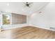Bright primary bedroom featuring tray ceilings, neutral walls, and vinyl floors at 13383 N 101St Way, Scottsdale, AZ 85260