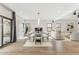 Spacious dining area with modern table set, fireplace, and natural light at 13383 N 101St Way, Scottsdale, AZ 85260